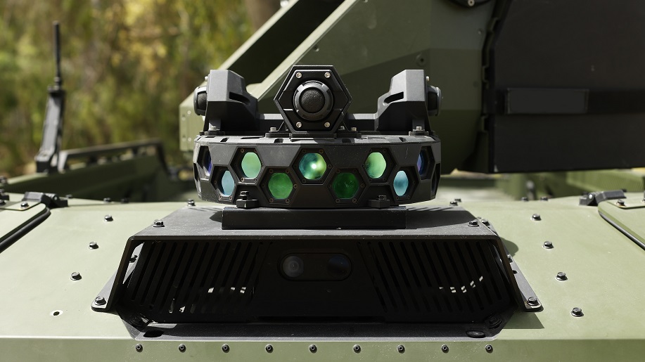 Compact multi-lens sensor unit mounted on a military vehicle