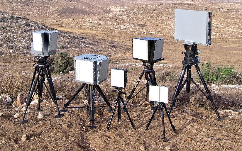Several radar panels on tripods in open terrain