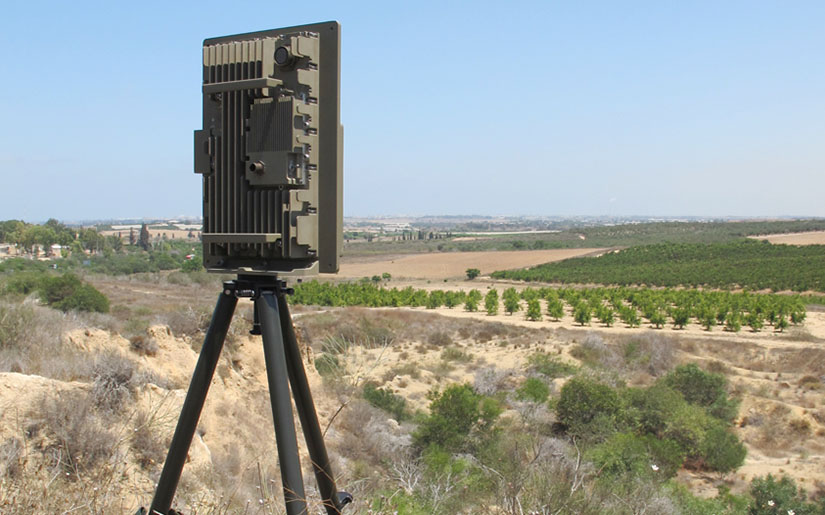 Radar panel on a tripod overlooking farmland