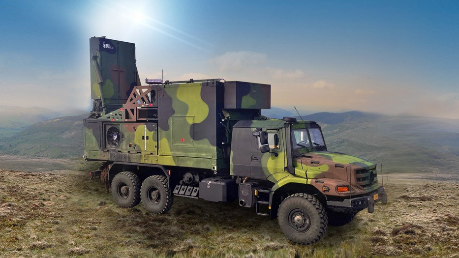 Camouflaged military truck carrying a large radar unit