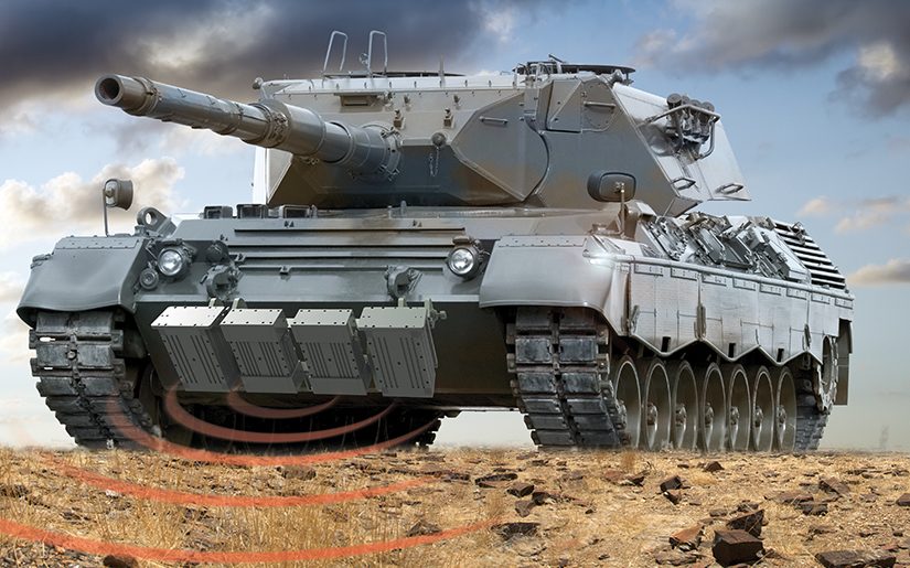 Battle tank on rocky ground with a sensor field around it