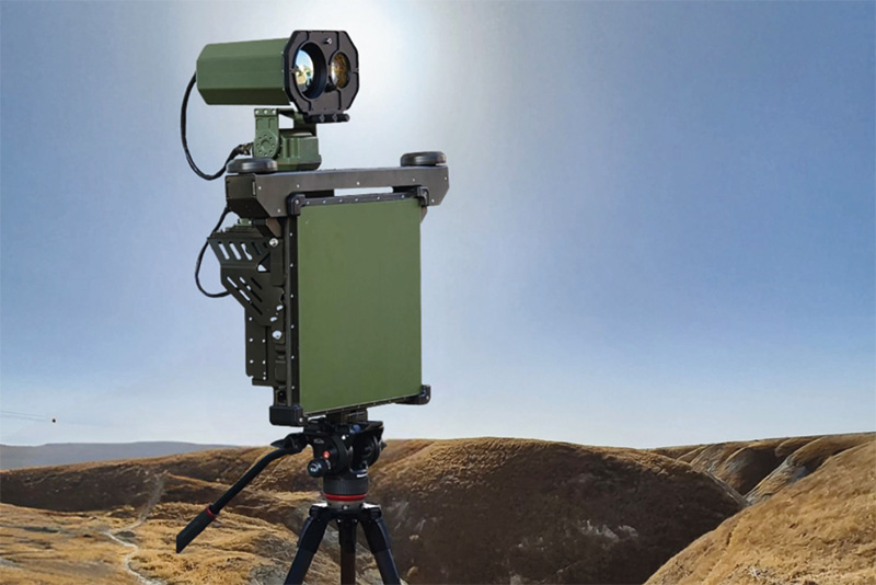 Sensor and radar unit on a tripod in hilly terrain