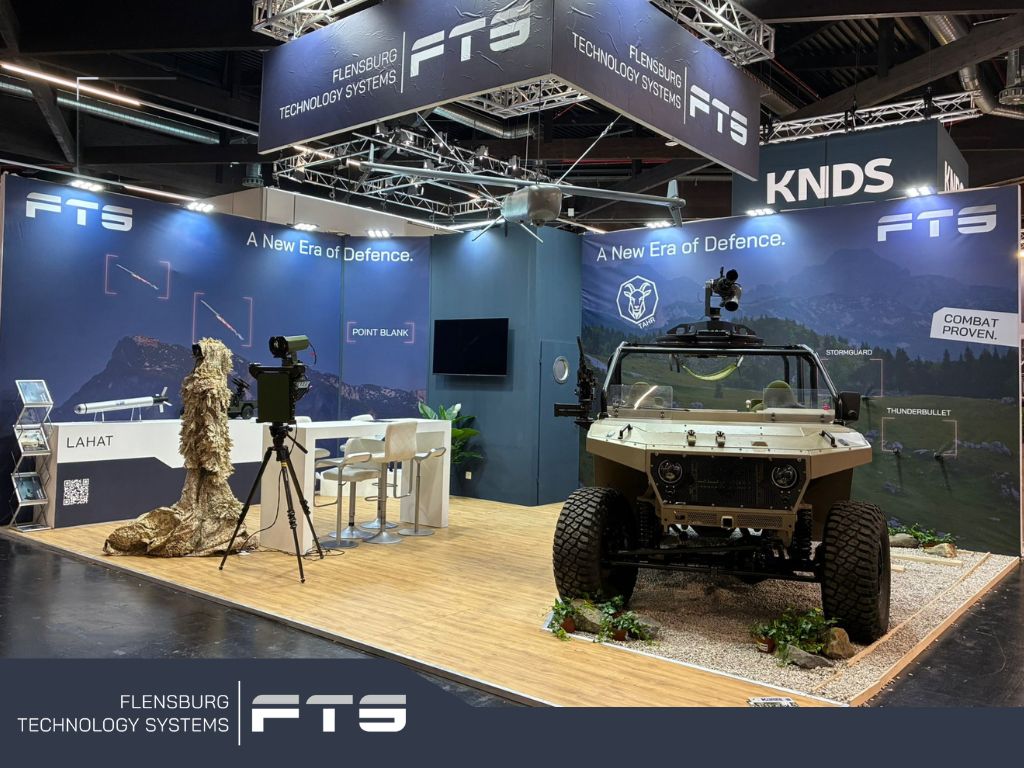 Exhibition booth with a vehicle and products on display
