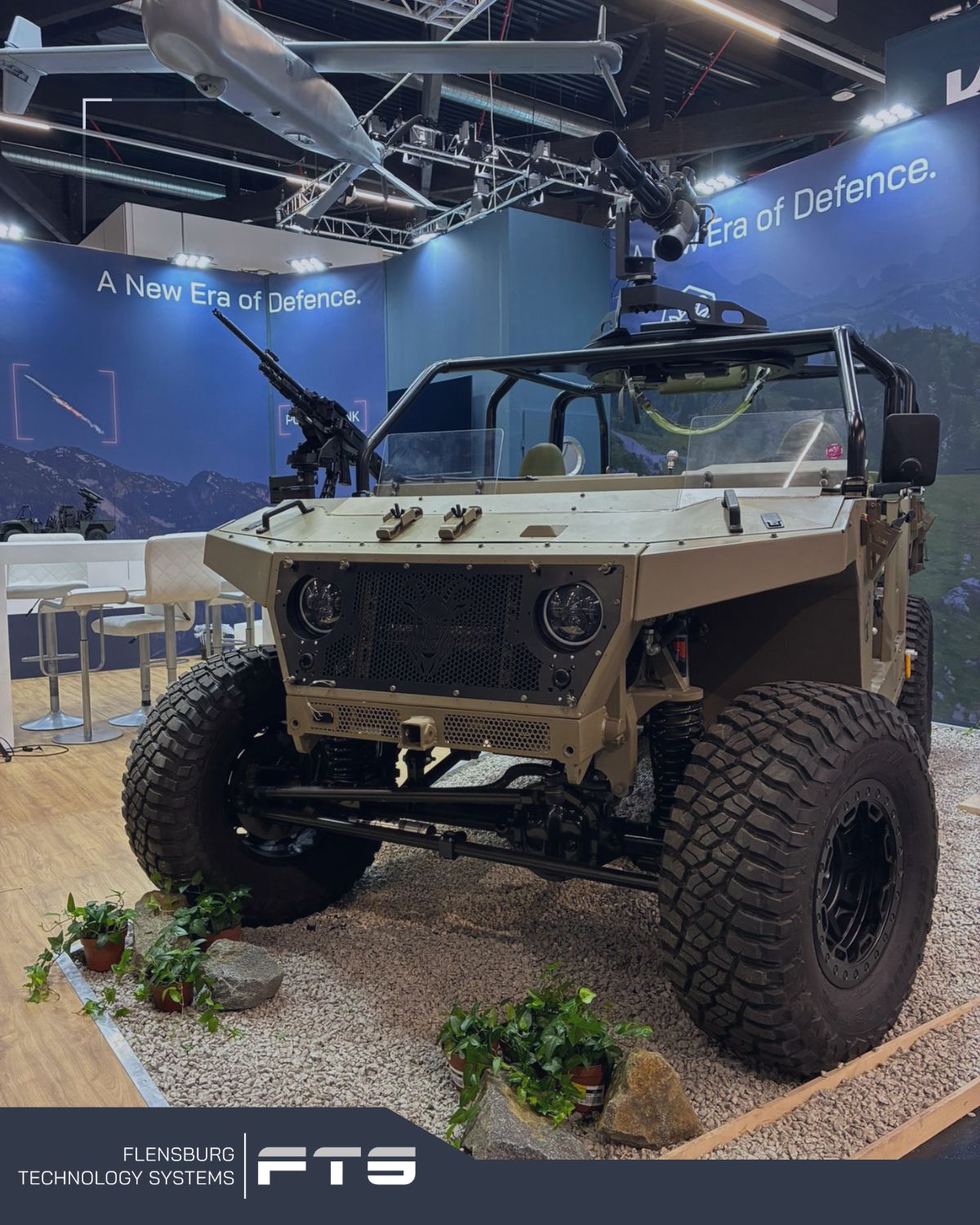 Light military vehicle displayed at an exhibition booth