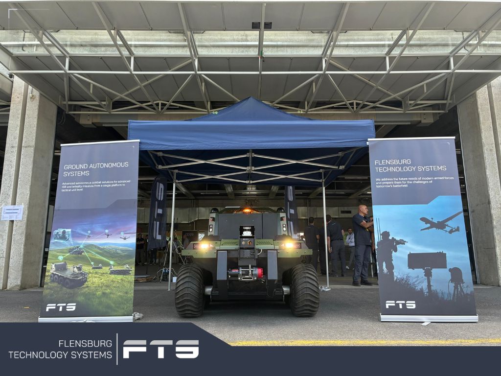 Unmanned ground vehicle under a tent at an outdoor event