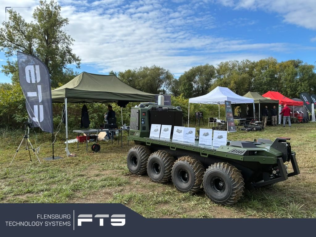 Eight-wheeled unmanned ground vehicle displayed at an outdoor exhibition